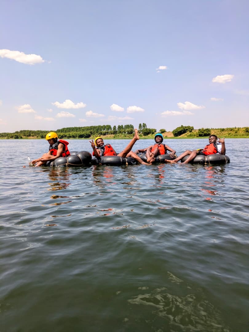 Group of four floating the flat Nile